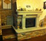 Fireplace Marco Simone: rustic slats and frame travertine